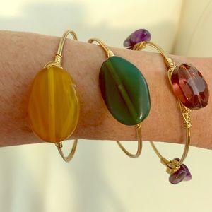 Set of three wire bracelets with 3 colored stones.